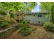 This backyard features a deck for relaxing and a terraced garden at 832 Wyntuck Nw Dr, Kennesaw, GA 30152
