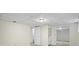 Neutral basement with carpet, white doors, and a mirrored closet at 832 Wyntuck Nw Dr, Kennesaw, GA 30152