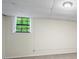 Basement with concrete walls, small window, and ceiling light at 832 Wyntuck Nw Dr, Kennesaw, GA 30152
