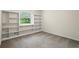 Bedroom features built-in bookshelves and natural light from the window at 832 Wyntuck Nw Dr, Kennesaw, GA 30152