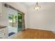 Dining room with wood floors and sliding glass doors leading to the back deck at 832 Wyntuck Nw Dr, Kennesaw, GA 30152