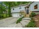 Charming home with a two-car garage, set amongst lush greenery at 832 Wyntuck Nw Dr, Kennesaw, GA 30152