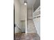 Foyer with tiled floor that lead to carpeted stairs and white railings at 832 Wyntuck Nw Dr, Kennesaw, GA 30152