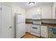 Efficient kitchen has updated appliances and neutral decor at 832 Wyntuck Nw Dr, Kennesaw, GA 30152