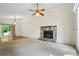 Spacious living room featuring a stone fireplace and sliding door to a backyard at 832 Wyntuck Nw Dr, Kennesaw, GA 30152