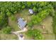 Aerial view showcasing the property's layout, including the house, driveway, and surrounding mature trees at 109 J O Simmons Path, Douglasville, GA 30134