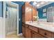 Traditional bathroom with wood vanity and shower/tub combo at 109 J O Simmons Path, Douglasville, GA 30134