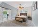 A beautifully appointed bedroom features an ensuite bath, a ceiling fan and natural light at 109 J O Simmons Path, Douglasville, GA 30134