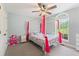 Charming bedroom with a four-poster bed, ample natural light, and light blue walls at 109 J O Simmons Path, Douglasville, GA 30134