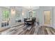 Bright dining room with hardwood floors, chandelier, and large windows at 109 J O Simmons Path, Douglasville, GA 30134