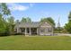 Charming single-story home with a covered front porch and well-manicured lawn at 109 J O Simmons Path, Douglasville, GA 30134