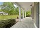Spacious covered porch with white columns offering views of the expansive front yard at 109 J O Simmons Path, Douglasville, GA 30134