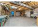 Large unfinished garage with exposed beams, shelving, and ample storage space at 109 J O Simmons Path, Douglasville, GA 30134