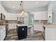 Modern kitchen features white cabinets, stainless appliances, and island with bar seating at 109 J O Simmons Path, Douglasville, GA 30134