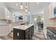 Well-equipped kitchen with stainless steel appliances, backsplash, and black island at 109 J O Simmons Path, Douglasville, GA 30134