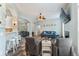 Open-concept living room features wood floors, lots of light, and access to other rooms at 109 J O Simmons Path, Douglasville, GA 30134