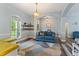 A bright living room featuring wood-look floors, seating area and natural light at 109 J O Simmons Path, Douglasville, GA 30134