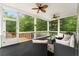 Cozy screened porch with ceiling fans, ample seating, and outdoor views at 109 J O Simmons Path, Douglasville, GA 30134