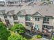 Aerial view of townhomes with lush landscaping, decks, and well-maintained exteriors at 2292 W Village Junction Se Way, Smyrna, GA 30080