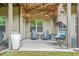 Cozy back porch with string lights, comfortable seating, and relaxed ambiance at 2292 W Village Junction Se Way, Smyrna, GA 30080