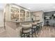 Stylish bar area with a granite countertop, seating for six, and well-stocked shelves at 2292 W Village Junction Se Way, Smyrna, GA 30080
