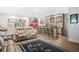 Basement bar featuring modern stools, open shelving, and adjacent seating area at 2292 W Village Junction Se Way, Smyrna, GA 30080