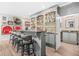 Finished basement featuring a custom bar with seating, sports memorabilia, and a full sink at 2292 W Village Junction Se Way, Smyrna, GA 30080