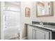Bright bathroom features a shower with a glass door, framed mirror and modern vanity at 2292 W Village Junction Se Way, Smyrna, GA 30080