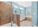 Bright bathroom featuring a tiled walk-in shower and a double sink vanity with white cabinets at 2292 W Village Junction Se Way, Smyrna, GA 30080