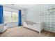 Cozy bedroom with blue accents, a window, and a playful atmosphere perfect for children at 2292 W Village Junction Se Way, Smyrna, GA 30080