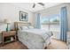 Inviting bedroom features a comfortable bed, a nightstand, and natural light from the window at 2292 W Village Junction Se Way, Smyrna, GA 30080