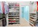 Well-organized closet with shelving for shoes and clothes, creating ample storage space at 2292 W Village Junction Se Way, Smyrna, GA 30080
