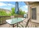 Cozy outdoor deck features a glass table with umbrella and outdoor cooking area at 2292 W Village Junction Se Way, Smyrna, GA 30080