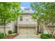 Charming two-story townhome with a brick facade, two-car garage, and well-maintained landscaping at 2292 W Village Junction Se Way, Smyrna, GA 30080
