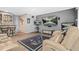 Modern living room featuring multiple TVs, comfortable seating, and a sleek bar area at 2292 W Village Junction Se Way, Smyrna, GA 30080