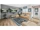 Inviting living room with hardwood floors, a comfy sofa, and multiple wall-mounted TVs at 2292 W Village Junction Se Way, Smyrna, GA 30080
