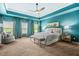 Spacious main bedroom with trey ceiling, ceiling fan, sitting area and ensuite bathroom at 2292 W Village Junction Se Way, Smyrna, GA 30080