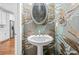 Chic powder room featuring elegant wallpaper and a pedestal sink at 2292 W Village Junction Se Way, Smyrna, GA 30080