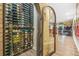 Impressive wine cellar with a brick wall and an arched glass door; houses a large collection of wines at 2292 W Village Junction Se Way, Smyrna, GA 30080