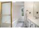 Bathroom featuring a soaking tub, marble floors, and vanity at 27 Sycamore Sta, Decatur, GA 30030