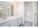 Bathroom featuring double sinks, marble floors, and a glass-enclosed shower at 27 Sycamore Sta, Decatur, GA 30030