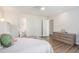 Bedroom with an ensuite bathroom, wood laminate floors, and a ceiling fan at 27 Sycamore Sta, Decatur, GA 30030