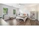 Bedroom featuring natural light, wood laminate floors, and a ceiling fan at 27 Sycamore Sta, Decatur, GA 30030