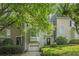 Charming two-story townhouse with lush landscaping, a one-car garage, and inviting curb appeal for comfortable living at 27 Sycamore Sta, Decatur, GA 30030