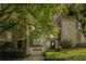 Charming two-story townhouse with lush landscaping, a one-car garage, and inviting curb appeal for comfortable living at 27 Sycamore Sta, Decatur, GA 30030