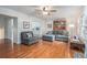 Inviting living room with hardwood floors, ceiling fan, and comfortable gray seating, perfect for relaxation and entertaining at 27 Sycamore Sta, Decatur, GA 30030