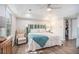 Bright main bedroom featuring a ceiling fan, wood floors, and a walk-in closet at 27 Sycamore Sta, Decatur, GA 30030