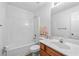 Bright bathroom features tub and shower combination and wood vanity at 2826 Snapfinger Mnr, Decatur, GA 30035