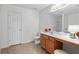 Well-lit bathroom featuring double sink vanity and separate toilet area at 2826 Snapfinger Mnr, Decatur, GA 30035