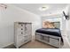 Nicely decorated bedroom features a queen bed, dresser, and TV at 2826 Snapfinger Mnr, Decatur, GA 30035